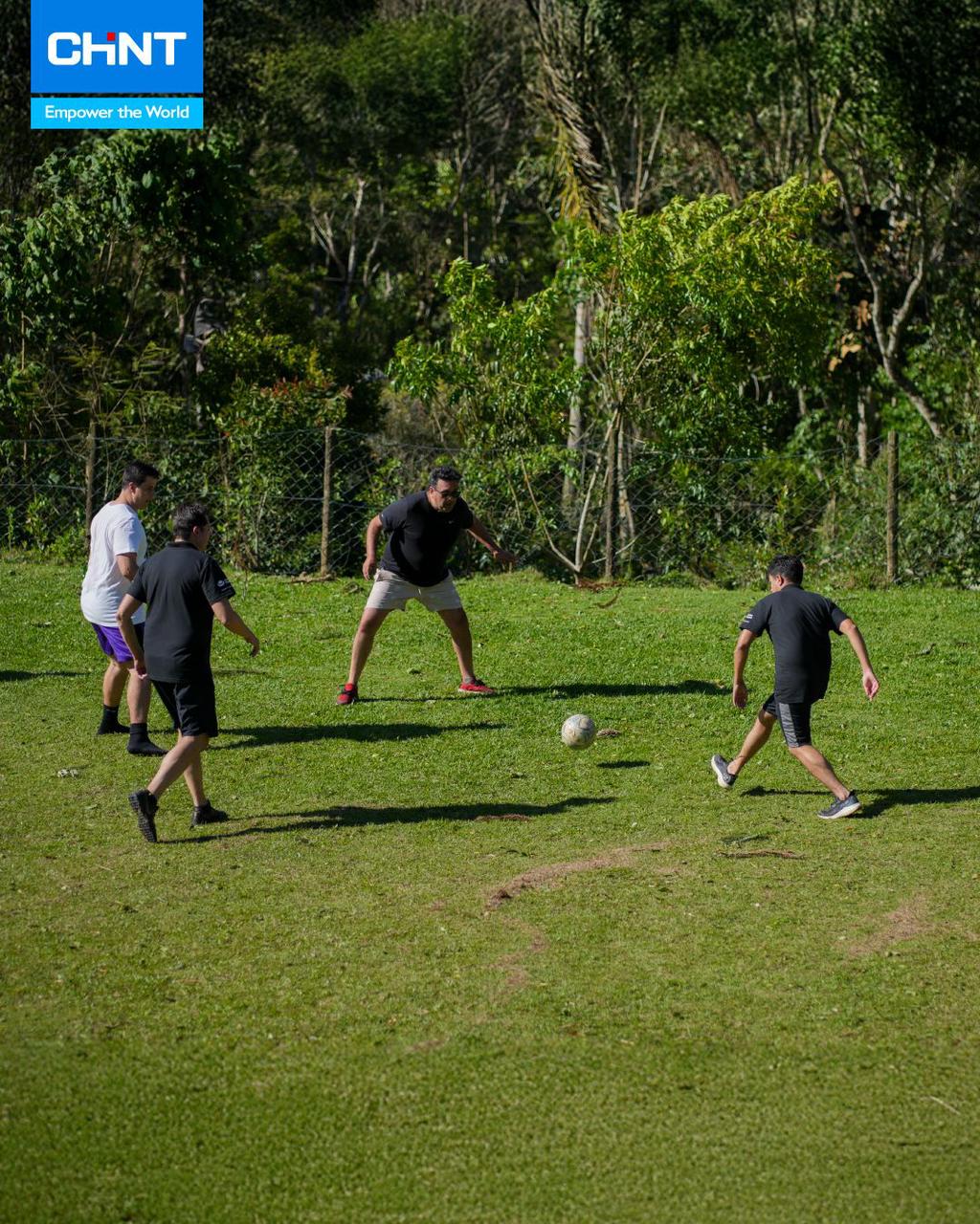 CHINT Brazil employees play football outdoors, embracing teamwork, energy, and festive year-end spirit