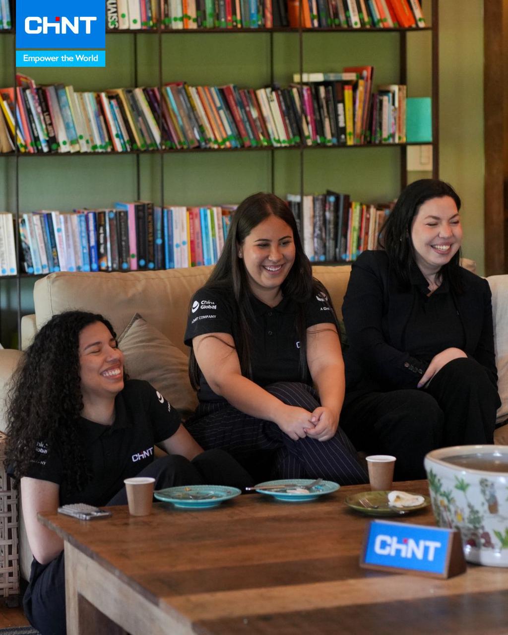 CHINT Brazil team shares a relaxed holiday gathering, celebrating collaboration and friendship in a warm office setting