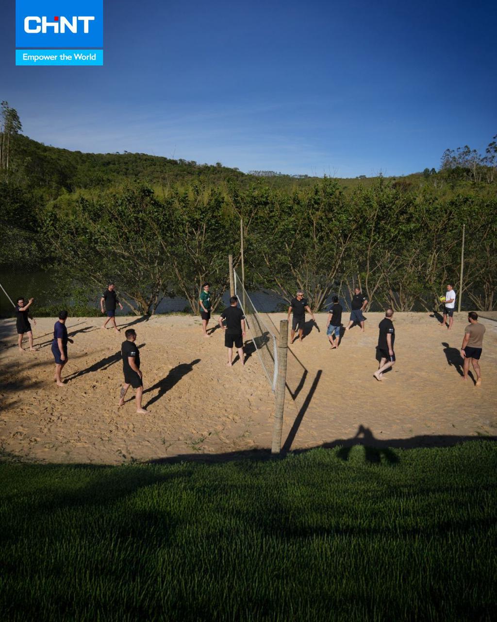 CHINT Brazil employees enjoy an outdoor volleyball game, strengthening teamwork and connection during year-end activities