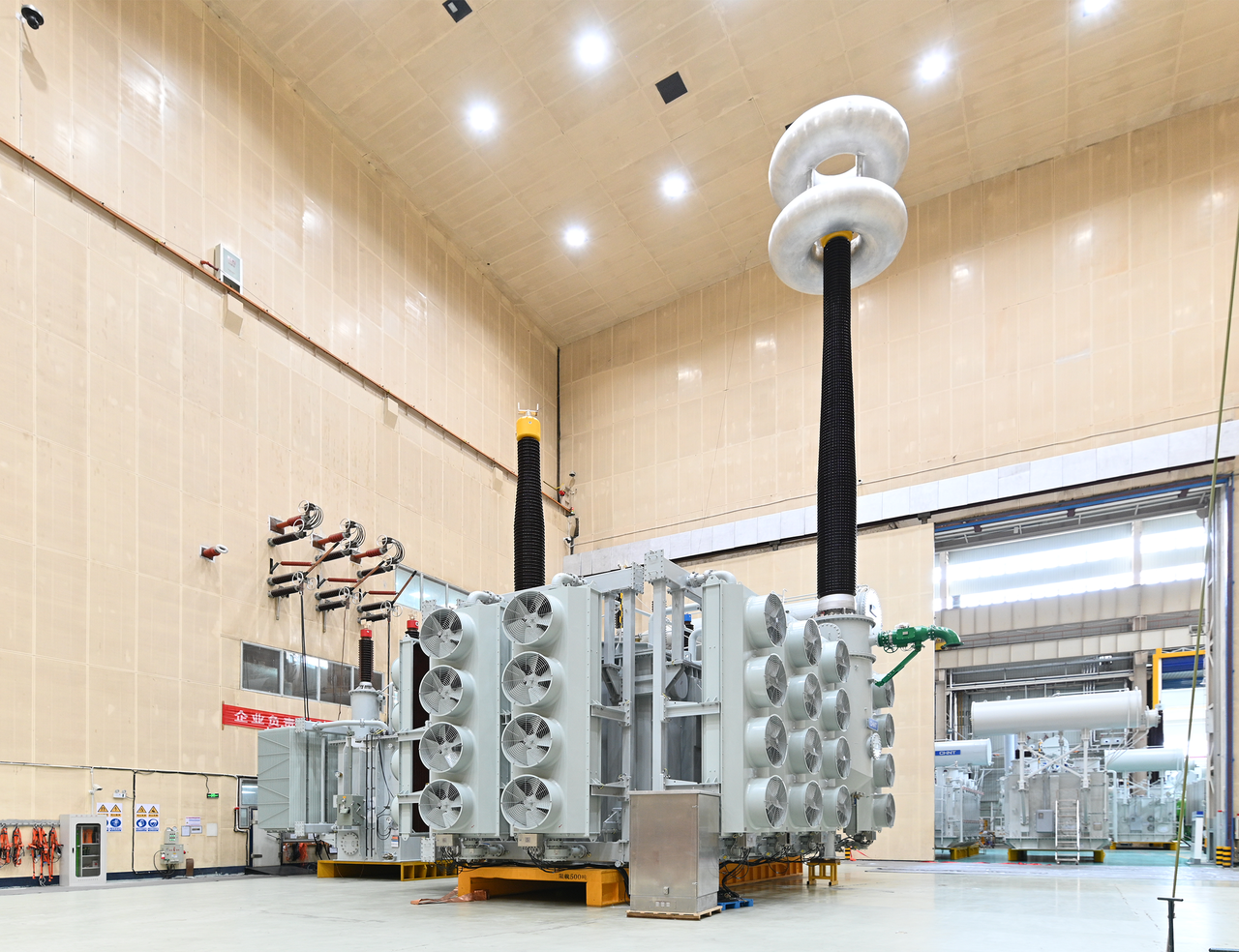 High-voltage substation with transformer equipment and electrical switchgear at night