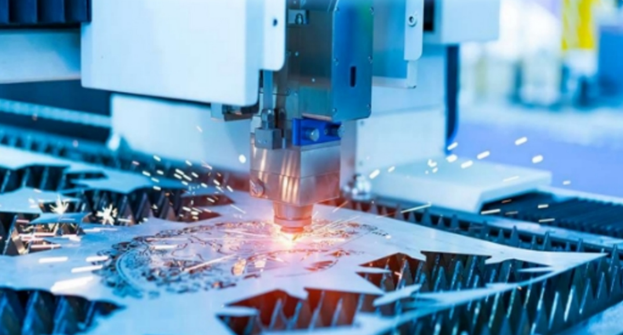 Industrial laser cutting machine in operation at CHINT Electrics factory, metal sheet processing with sparks